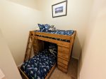 Semi-private den bedroom with twin bunk bed. 